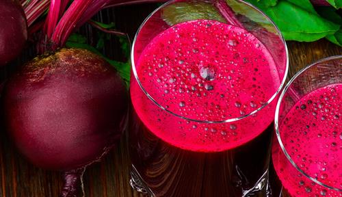 Photograph of raw beets and beet juice